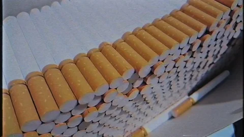 A lot of empty cigarette blanks in a large cardboard box. VHS video footage 1080 Stock Footage 123571873