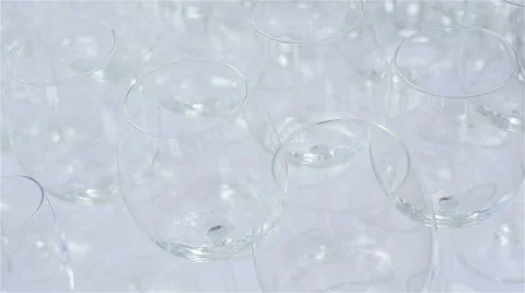 A lot of empty glasses on white table cloth. Glassware macro close up Stock Footage 62192849