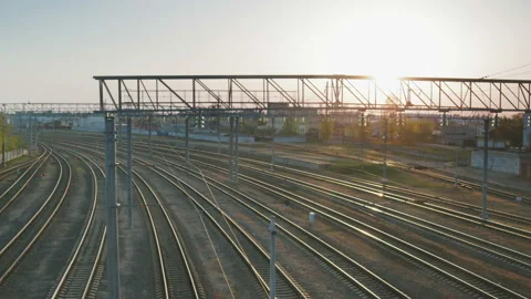 A lot of empty railway tracks on the background of the setting sun 스톡 동영상 112275505
