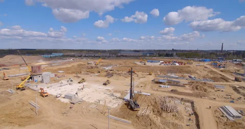 A lot of equipment is working on the construction of a new, modern factory Stock Footage 161961297