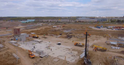 A lot of equipment is working on the construction of a new, modern factory Stock Footage 161961587