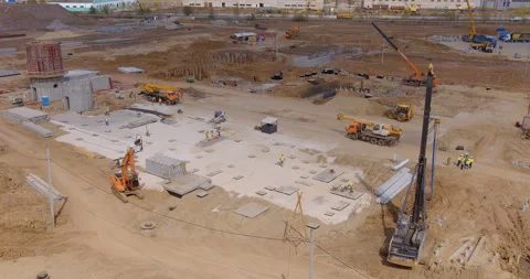 A lot of equipment is working on the construction of a new, modern factory Stock Footage 161961706