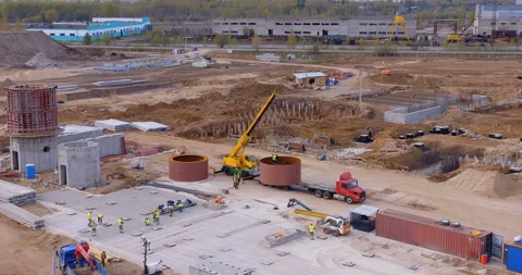 A lot of equipment is working on the construction of a new, modern factory Stock Footage 161963447