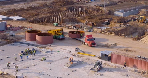 A lot of equipment is working on the construction of a new, modern factory Stock Footage 161965951
