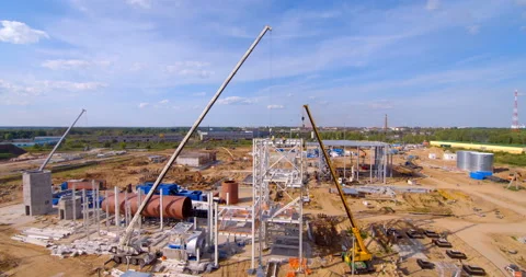 A lot of equipment is working on the construction of a new, modern factory Stock Footage 161987310