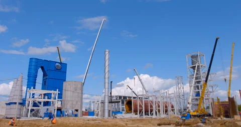 A lot of equipment is working on the construction of a new, modern factory Stock Footage 161990547