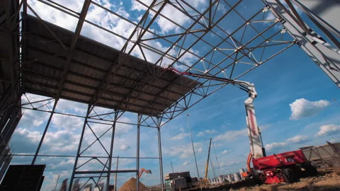 A lot of equipment is working on the construction of a new, modern factory Stock Footage 162001616
