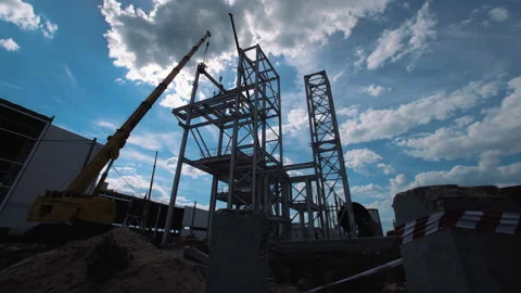 A lot of equipment is working on the construction of a new, modern factory Stock Footage 162001757