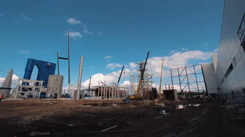 A lot of equipment is working on the construction of a new, modern factory Stock Footage 162001875