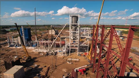 A lot of equipment is working on the construction of a new, modern factory Stock Footage 162002393