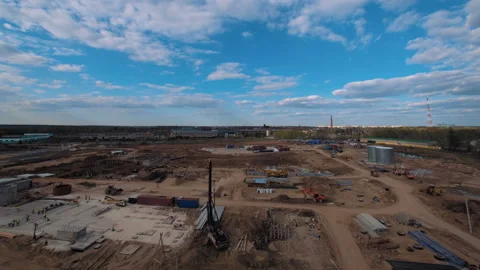 A lot of equipment is working on the construction of a new, modern factory Stock Footage 162002640