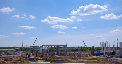 A lot of equipment is working on the construction of a new, modern factory Stock Footage 162017569