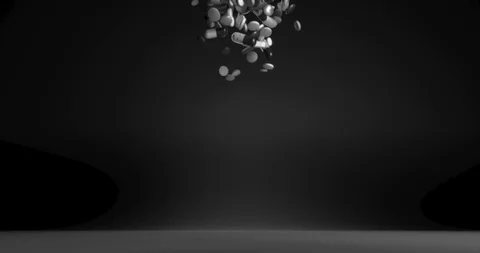 A lot of falling medicaments on a black background. Black and white capsules and 스톡 동영상 112993046