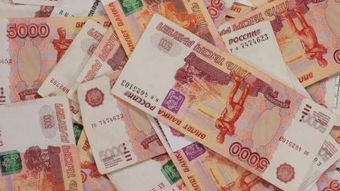 A lot of five thousand Russian banknotes are slowly rotating in a circle. Stock Footage 310656142