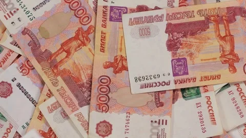 A lot of five thousand Russian banknotes are slowly rotating in a circle. Stock Footage 314603769