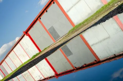 A lot of garages, puddle with reflection. Stock Photos