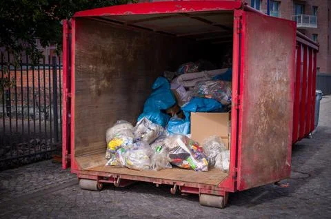 A lot of garbage is transported in a large container Stock Photos