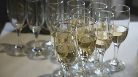 A lot of glasses with sparkling wine on table Stock Footage 76940742