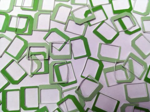 A lot of green plastic SIM frames Stock Photos