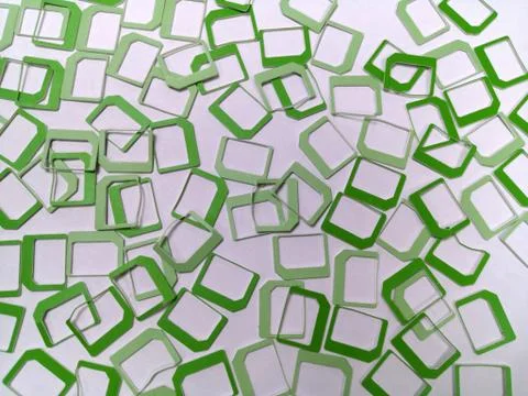 A lot of green plastic SIM frames Stock Photos