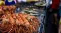 A lot of grilled shrimps and fish on the street of Bangkok, Thailand HD Footage
