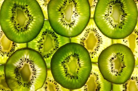 A lot of kiwi sheets as fruit background. Stock Photos