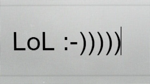 Lot of Laugh LOL word processing closeup computer screen or monitor Stock Footage 82992493