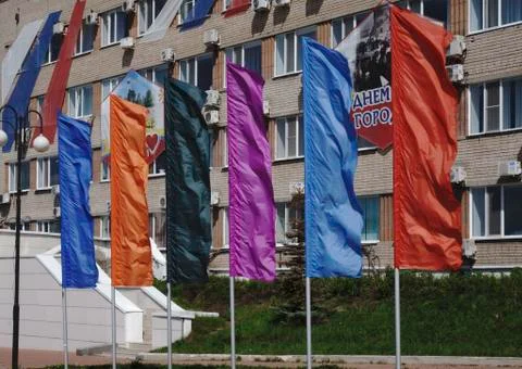 A lot many flags. flags in the blue sky with white clouds. Russia Berezniki 1 Photos