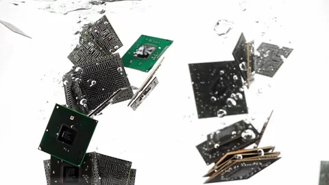 A lot of micro video chips are falling and immersing in water filmed against Stock Footage 288535264