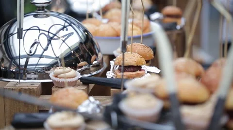 A lot of mini-burgers at the serving area. Food festival burgers. Stock Footage