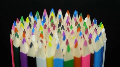 Lot of mini colored pencils rotating in front of black background 스톡 동영상 222958220