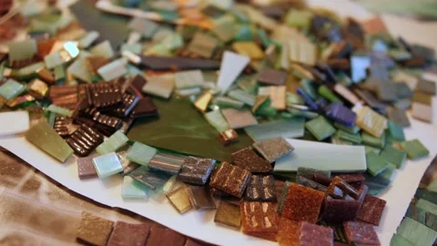 Lot of mosaic pieces. Creating of pattern with small pieces of colored glass and Video stock 138679095