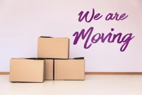 Lot of moving boxes in an empty room 写真素材