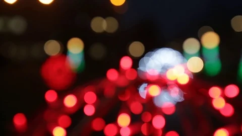 A lot of multi-colored bokeh on a black background in the street Stock Footage 122598719