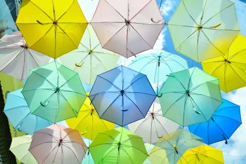 A lot of multicolored umbrellas under the sky Foto stock