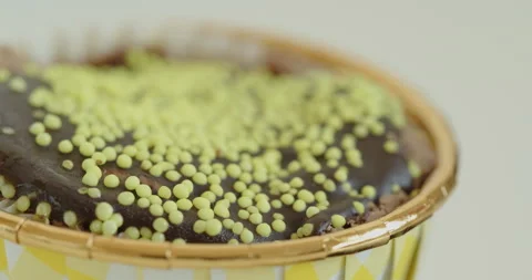 Lot od tiny sprinkles over the muffin top 4K close-up video Stock Footage 262008646