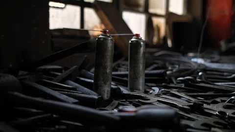 A lot of old greasy tools and keys on a work bench Stock Footage 107173193