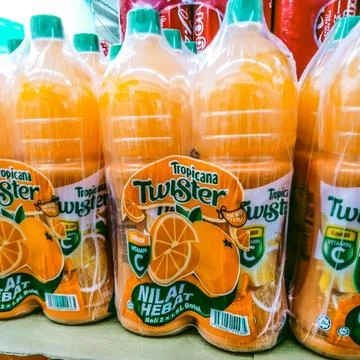 A lot of orange juice in the package Stock Photos