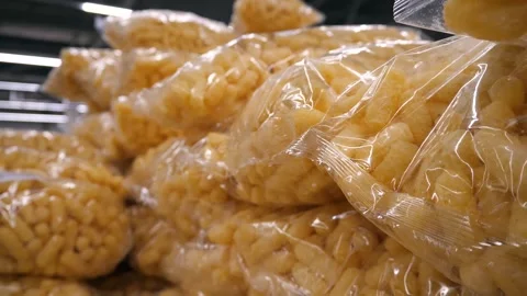 A lot of packets of  puffed corn snacks. Stock-Footage 268147740
