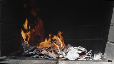 A lot of paper is burning in the grill Stock Footage 273734695
