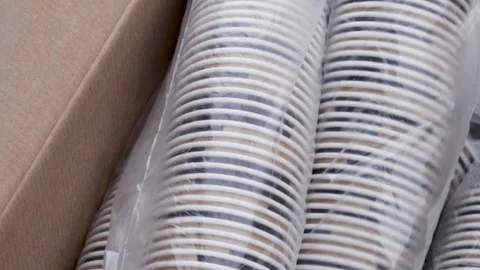 A lot of paper cups in a row, in a cellophane pack 스톡 동영상 166118675