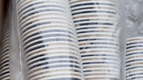 A lot of paper cups in a row, in a cellophane pack Vídeo Stock 166118766