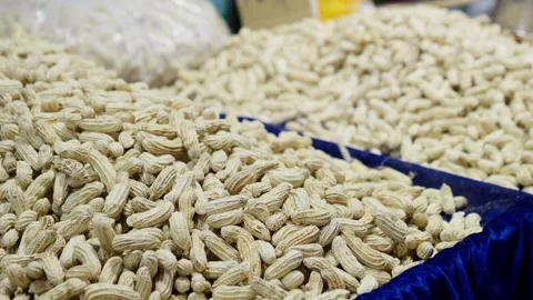 A lot of peanuts pile up, washed peanuts, and unpeeled peanuts Stock Footage 322776707