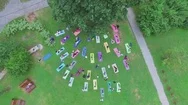 Lot Of People Do Yoga Exercises In Park At Summer Day. Aerial View Stock Footage