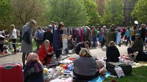 A lot of people at the flea market in the city Park Stock Footage