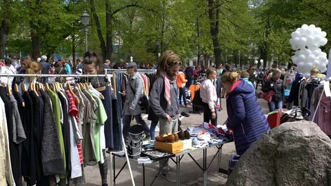 A lot of people at the flea market in the city Park Stock Footage