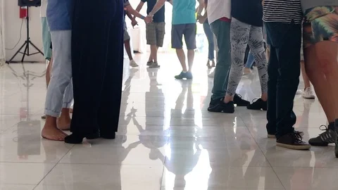 A lot of people practicing dance on a white floor, just the leg Stock Footage 92072895
