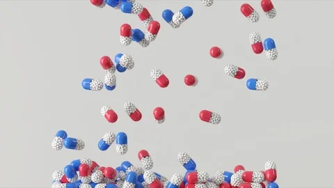 A lot of pills fall on a light background, slow motion Stock Footage 125976491