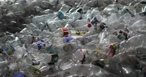 A lot of plastic bottles with caps and labels. Close-up. Stock Footage 156080879