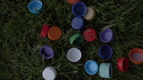 A lot of plastic covers are lying on the lawn Stock Footage 120090009